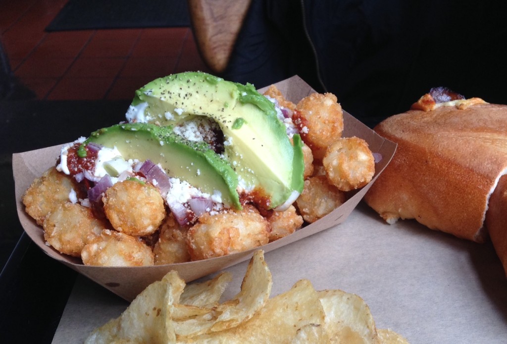 Tater tots with mole, avocado, cotija and crema are just as delicious as they sound. Photo: Annaliese Griffin